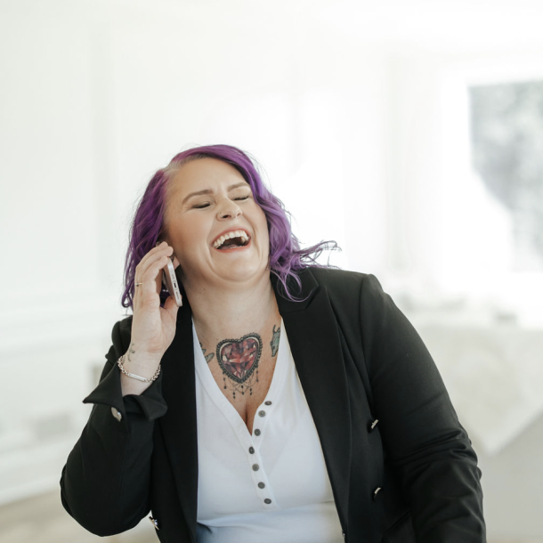 Robyn laughing at her realtor branding photoshoot