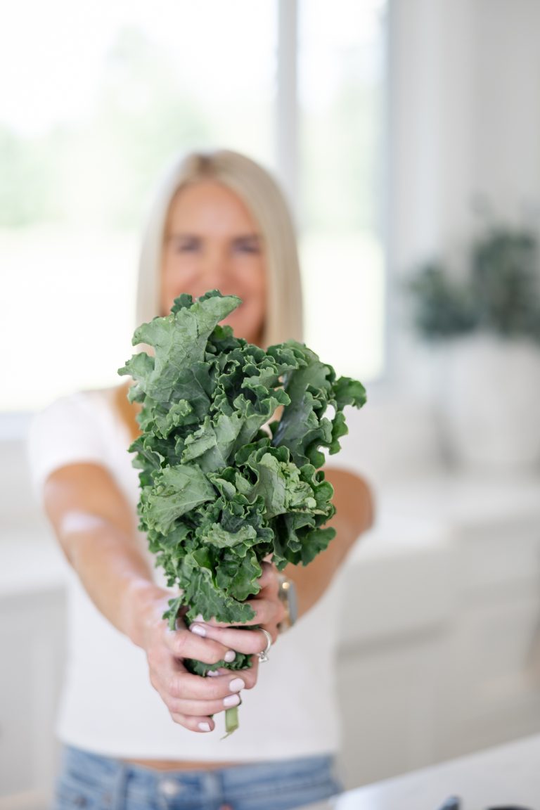 Nutrition coach setting up a workspace with fresh ingredients and educational materials in the Lower Mainland.