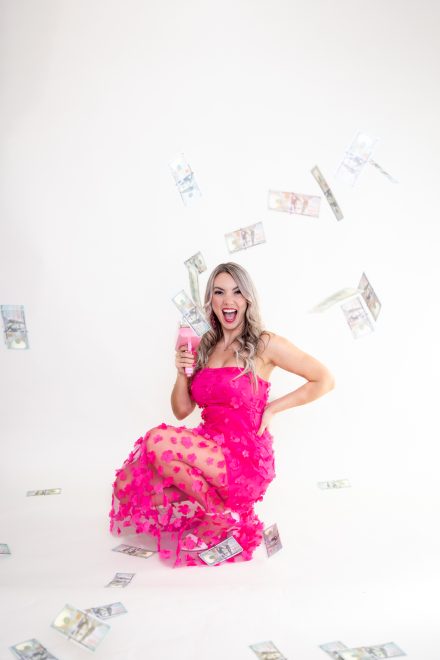 Confident female entrepreneur smiling warmly in a bright Vancouver studio, showcasing her vibrant and approachable brand personality.