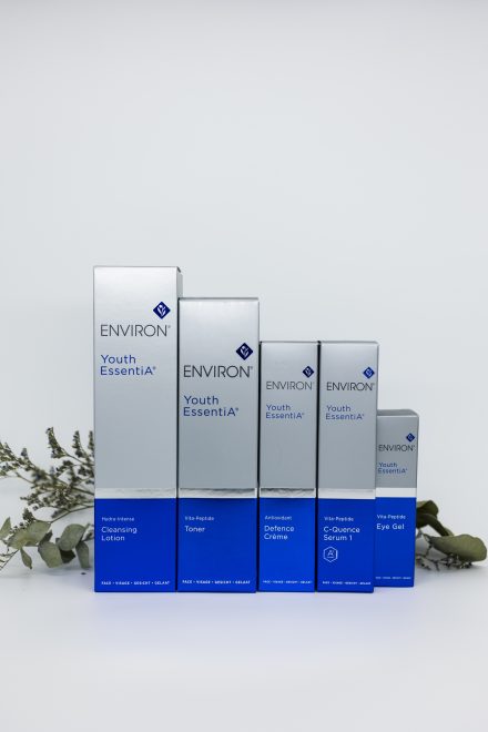 A selection of luxury skincare products arranged neatly on a crisp white background, highlighting their clean and professional design