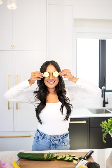 Confident dietitian standing in a well-lit kitchen in Fraser Valley, ready to guide clients on their wellness journey.