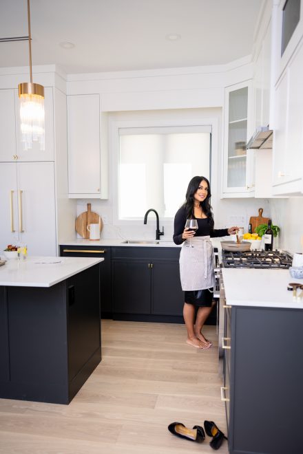 Confident dietitian standing in a well-lit kitchen in Abbotsford ready to guide clients on their wellness journey.