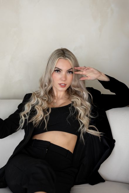 Lady boss sitting casually and confidently on sofa in local lower mainland studio