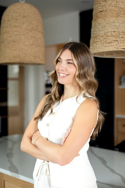 Professional realtor standing confidently in modern kitchen