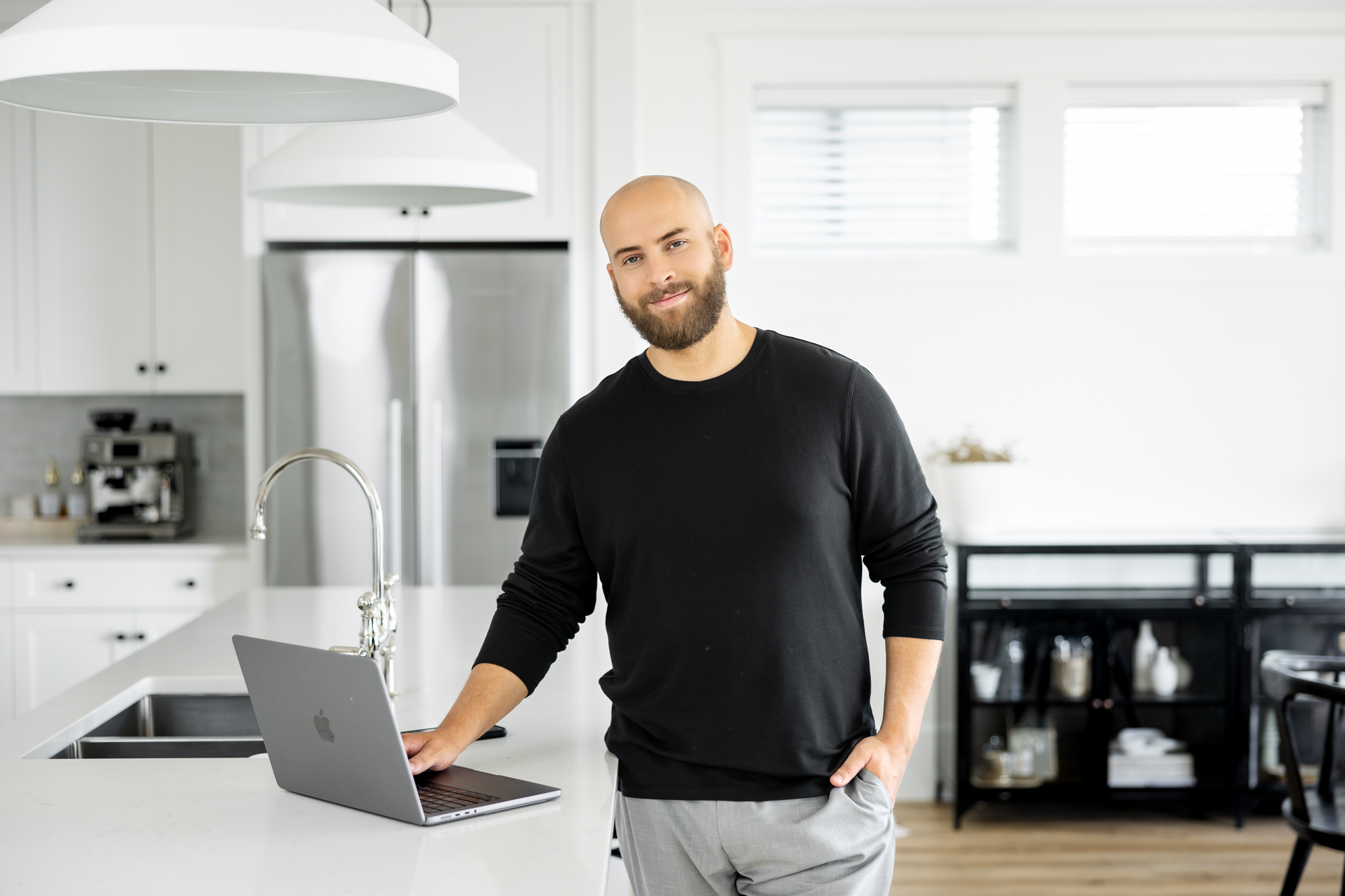 Male mortgage broker working in a kitchen